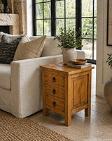 Side table beside sofa showing scale and finish