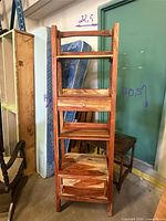 Front view of full bookcase showing shelves, drawer, cabinet door, and dimensions marked