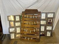Front view of seating chart board flanked by two collage frames