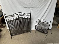 Fireplace screen and log holder side by side on floor