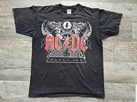 Full front view of the AC/DC Black Ice Tour T-shirt laid flat.