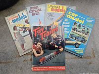 All five magazines laid out showing front covers