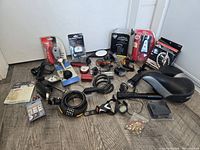 overview of entire lot showing seat, pump, locks, packaged lights and accessories