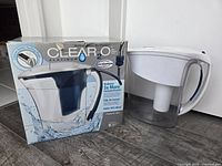 Clear2O pitcher box beside Brita jug