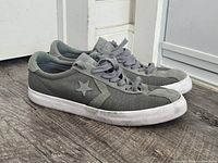 Left side view of olive green Converse Breakpoint Ox sneakers showing star logo and white sole