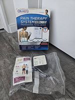 Retail box front for DR-HO'S Pain Therapy System 4 Pad Professional TENS Device