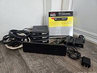 Entire lot showing converters, antenna, cables, remote and box