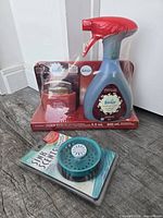 Full lot view: sealed Febreze spray/candle pack with BSI Sink Scents blister