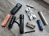 overview of flashlights, multi-tools, pouch