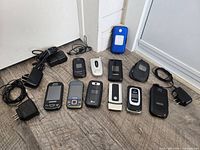 Group shot of all phones, chargers and pouch