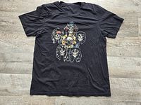 Full view of black Guns N' Roses graphic T-shirt laid flat