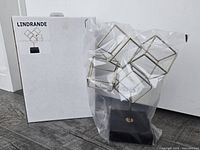 Sculpture in bag beside original IKEA box