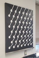 Front view showing full peg layout on black board