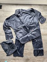 Full rain suit laid out with storage bag
