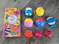 Book set, four teacup mugs, four figurines overview