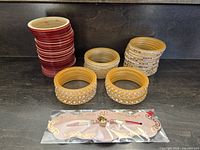 Stacked red, beige-gold, amber-gold bangles and packaged decorative bracelet