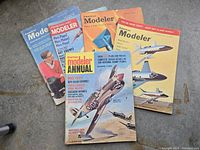 Front covers of the five American Modeler magazines