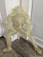 Front view of translucent Stealth Scar Predator figure