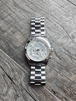 Full view of watch front, case and bracelet visible