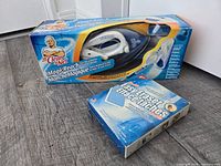 Mr. Clean Magic Reach starter kit box with cleaning tool visible and Double Easy Eraser pad box