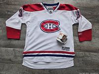 Front view of Reebok Montreal Canadiens #31 Price jersey with coffee mug placed on jersey