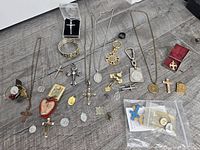 Full layout of necklaces, bracelet, boxed pendant and loose medals