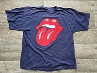 Full view of navy Rolling Stones patch T-shirt laid flat