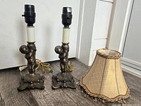 two cherub lamp bases and fabric shade