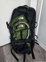 Front view showing The North Face backpack, color, detachable front pocket, compression straps