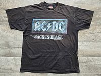Full view of black AC/DC Back In Black T-shirt laid flat