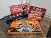 Group shot of all five board game boxes