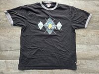 Front view of entire black T-shirt with grey trim and graphic