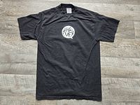 Front view of black T-shirt with speech bubble graphic