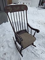 Full view of rocking chair angled left showing overall design and rockers