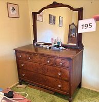 Front view of dresser showing drawers, knobs, mirror