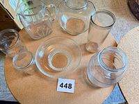 All six glass containers displayed on table