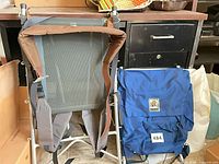 Two external frame backpack items: one blue Golden Bear backpack, one bare aluminum frame