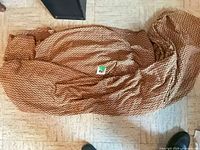 Bedspread laid out showing overall size and pattern