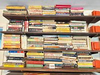 Full bookshelf with approximately five shelves of assorted books