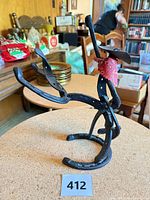 Front angled view of welded horseshoe cowboy figure