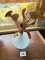 vase front view with dried flower arrangement