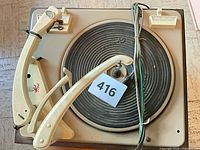 Top view showing Garrard Model 210 turntable mechanism, tonearm, platter, changer arm, wiring