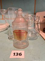 Front view of both glass pitchers and the Perugina Sorrento candy jar with lid