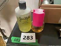 Front view of Jean Nate and Ambush bottles showing labels and fill levels