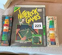 Three boxed toys: Notebook Games Football, Magic Maze puzzle, math cylinder puzzle