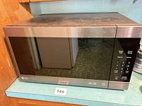 Front view of LG countertop microwave showing exterior condition and control panel