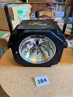 Front angled view showing reflector and housing