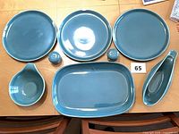 Full set laid out: three plates, two shakers, tear-drop bowl, gravy boat, oval platter