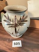 Front view showing bamboo motif decoration and overall shape