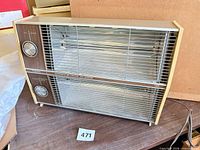 Full front view of Presto forced-air heater showing overall design and grille